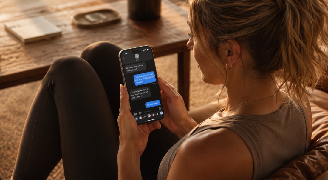 A woman texting Ovea from home